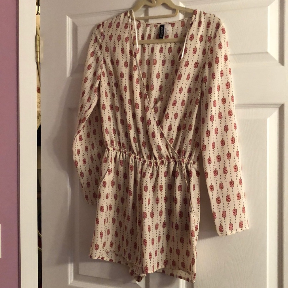 Long sleeved romper with red and black patterns